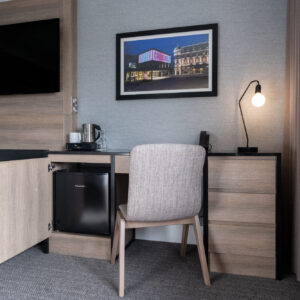 Thumbnail of http://A%20hotel%20room%20featuring%20a%20desk,%20chair,%20and%20television,%20designed%20for%20comfort%20and%20convenience.