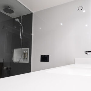 Thumbnail of http://A%20modern%20bathroom%20featuring%20a%20glass%20shower%20stall%20and%20a%20sleek%20sink,%20showcasing%20a%20clean%20and%20minimalist%20design.