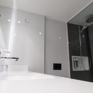 Thumbnail of http://A%20sleek%20modern%20bathroom%20featuring%20a%20glass%20shower%20stall%20and%20contemporary%20fixtures.