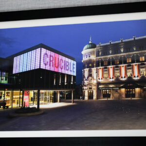 Thumbnail of http://A%20framed%20photo%20of%20The%20Crucible,%20an%20iconic%20landmark%20in%20Sheffield,%20showcasing%20its%20architectural%20details%20at%20night.